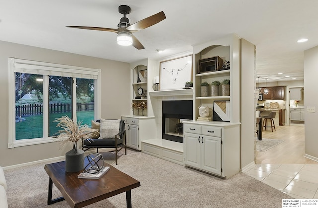 16712 V St, Omaha, NE 68135 - living room with a ceiling fan, light colored carpet, light tile patterned floors, a fireplace, and recessed lighting