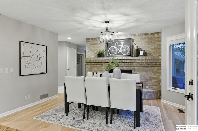 16712 V St, Omaha, NE 68135 - dining space featuring a chandelier, wood finished floors, baseboards, and recessed lighting