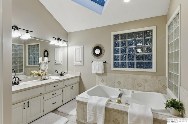 16712 V St, Omaha, NE 68135 - bathroom with double vanity, a bath, a skylight, lofted ceiling, and tile patterned floors