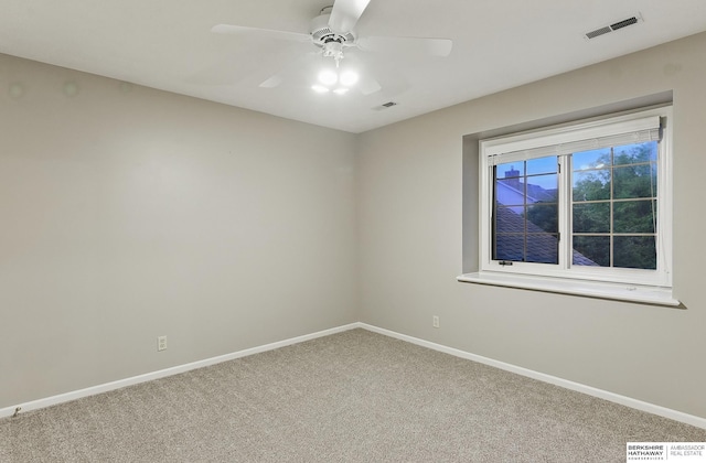 16712 V St, Omaha, NE 68135 - unfurnished room with carpet floors, baseboards, and a ceiling fan