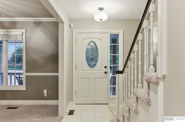 16712 V St, Omaha, NE 68135 - tiled foyer entrance with stairway, baseboards, and ornamental molding