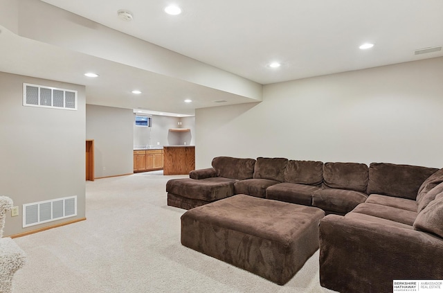 16712 V St, Omaha, NE 68135 - living area featuring light carpet, recessed lighting, bar, and baseboards