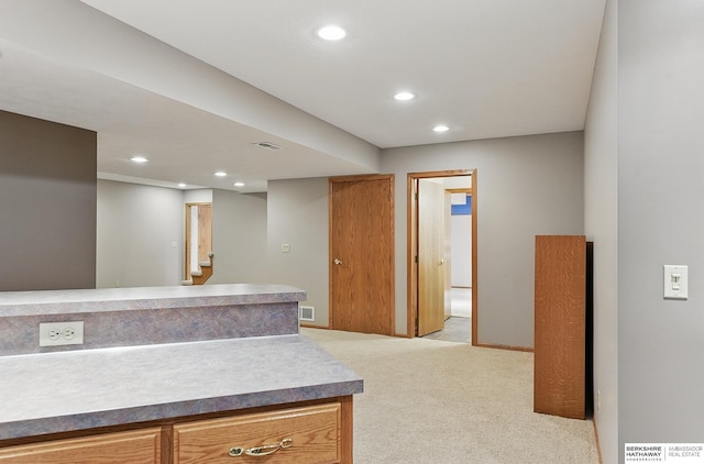 16712 V St, Omaha, NE 68135 - kitchen with recessed lighting, light carpet, and baseboards