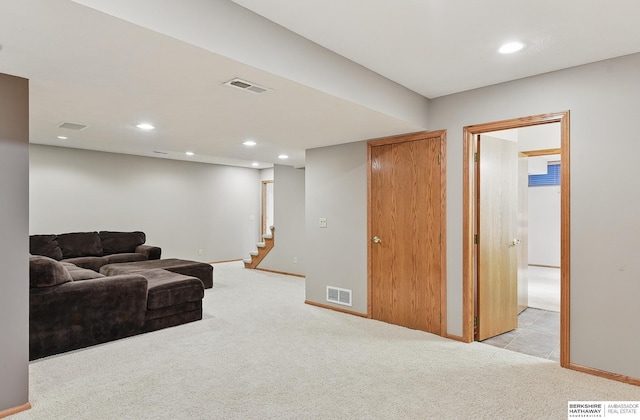 16712 V St, Omaha, NE 68135 - living area featuring light carpet, recessed lighting, stairs, and baseboards