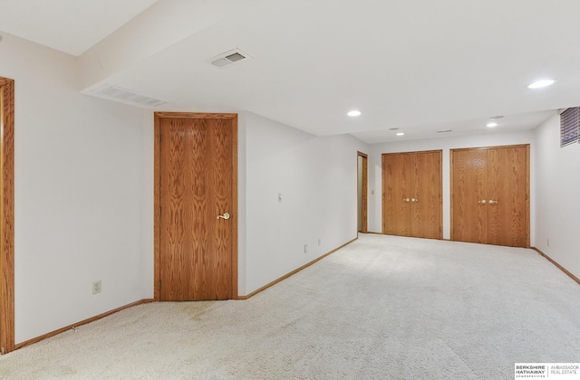 16712 V St, Omaha, NE 68135 - unfurnished bedroom with baseboards, carpet floors, recessed lighting, and multiple closets