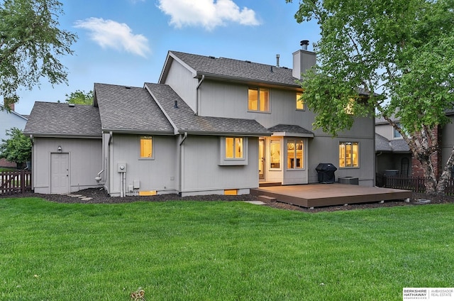 16712 V St, Omaha, NE 68135 - back of property with a deck, a chimney, and a shingled roof