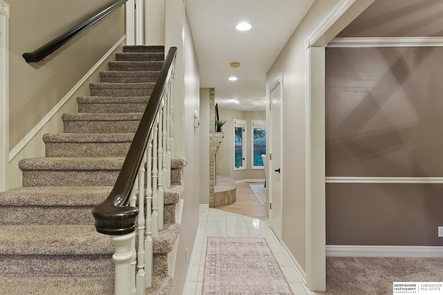 16712 V St, Omaha, NE 68135 - staircase with recessed lighting, tile patterned flooring, and baseboards