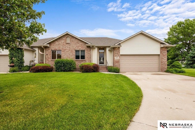 650 Heatherwood Dr, Fremont, NE 68025 - single story home with brick siding, an attached garage, driveway, a front yard, and roof with shingles