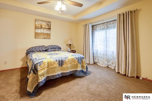 650 Heatherwood Dr, Fremont, NE 68025 - bedroom featuring carpet flooring, baseboards, and a ceiling fan