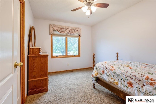 650 Heatherwood Dr, Fremont, NE 68025 - carpeted bedroom with baseboards and ceiling fan