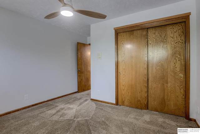 15010 Normandy Blvd, Bellevue, NE 68123 - unfurnished bedroom with carpet floors, a closet, baseboards, and ceiling fan