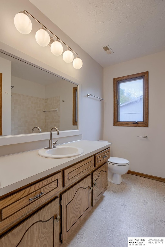 15010 Normandy Blvd, Bellevue, NE 68123 - bathroom with vanity, toilet, and baseboards