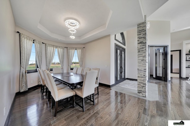 17380 S 77th Pt, Hickman, NE 68372 - dining area with wood finished floors, baseboards, a tray ceiling, and a chandelier