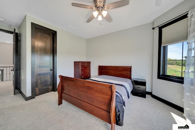 17380 S 77th Pt, Hickman, NE 68372 - bedroom with light carpet, baseboards, and a ceiling fan
