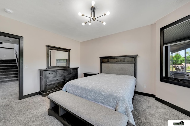 17380 S 77th Pt, Hickman, NE 68372 - carpeted bedroom featuring a chandelier and baseboards