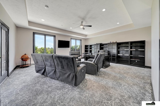 17380 S 77th Pt, Hickman, NE 68372 - carpeted home theater featuring a ceiling fan, a tray ceiling, recessed lighting, and baseboards