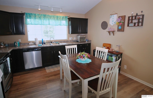 21006 Paradise Dr, Gretna, NE 68028 - kitchen with stainless steel dishwasher, range with electric cooktop, a sink, wood finished floors, and dark cabinets