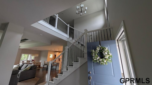 5815 S 238th St, Elkhorn, NE 68022 - stairway with a chandelier and a high ceiling