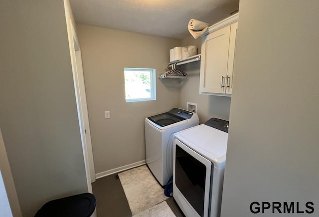 5815 S 238th St, Elkhorn, NE 68022 - laundry area featuring washer and clothes dryer, cabinet space, and baseboards