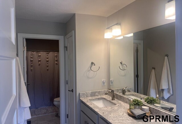 5815 S 238th St, Elkhorn, NE 68022 - bathroom featuring toilet, vanity, and a shower with curtain