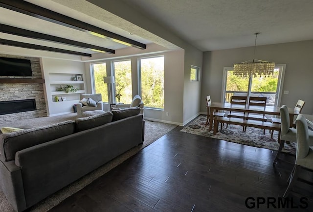 5815 S 238th St, Elkhorn, NE 68022 - living area featuring baseboards, a fireplace, plenty of natural light, beam ceiling, and dark wood finished floors