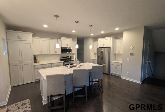 5815 S 238th St, Elkhorn, NE 68022 - kitchen featuring stainless steel appliances, a sink, tasteful backsplash, baseboards, and recessed lighting