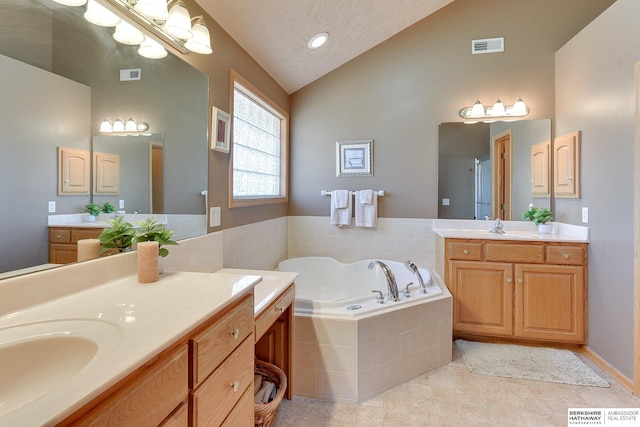 4804 Fountain Cir, Papillion, NE 68133 - full bath with a garden tub, high vaulted ceiling, two vanities, and tile patterned floors