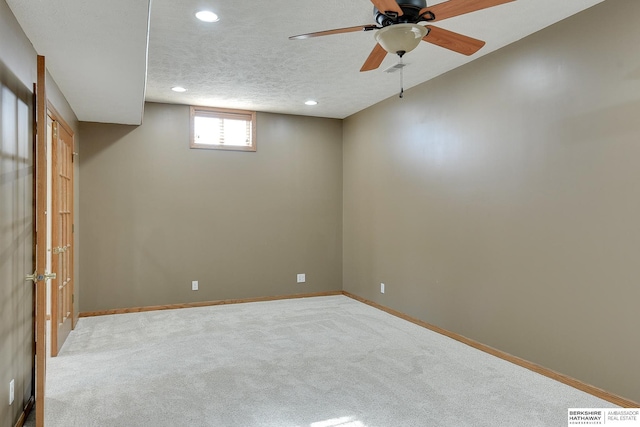 4804 Fountain Cir, Papillion, NE 68133 - basement with recessed lighting, carpet flooring, baseboards, ceiling fan, and a textured ceiling