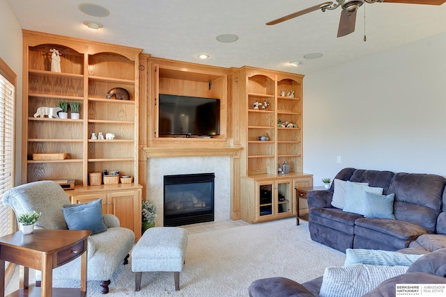 4804 Fountain Cir, Papillion, NE 68133 - carpeted living area featuring a ceiling fan, a tiled fireplace, and recessed lighting