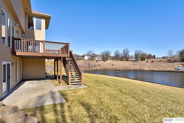 4804 Fountain Cir, Papillion, NE 68133 - view of green lawn featuring stairway, a patio, and a deck with water view