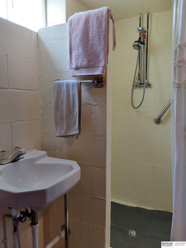 7027 S 39th Ave, Bellevue, NE 68147 - bathroom with a shower stall and concrete block wall
