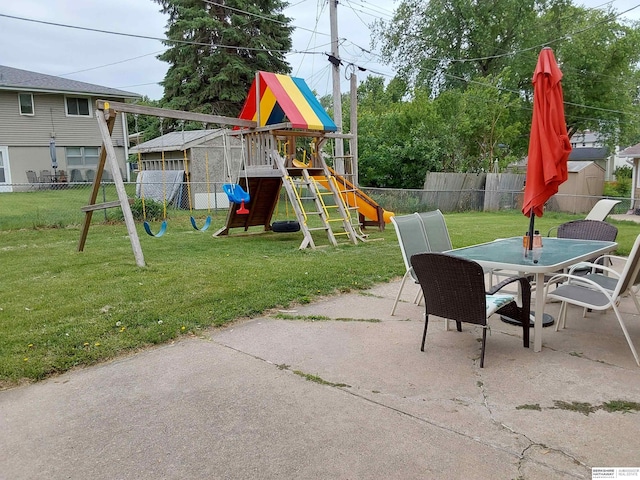 7027 S 39th Ave, Bellevue, NE 68147 - view of jungle gym with a patio area, outdoor dining space, and a storage unit