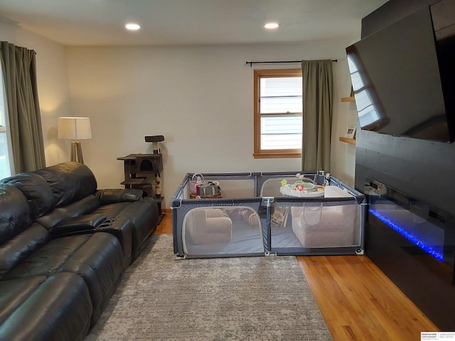 7027 S 39th Ave, Bellevue, NE 68147 - living room featuring wood finished floors and recessed lighting