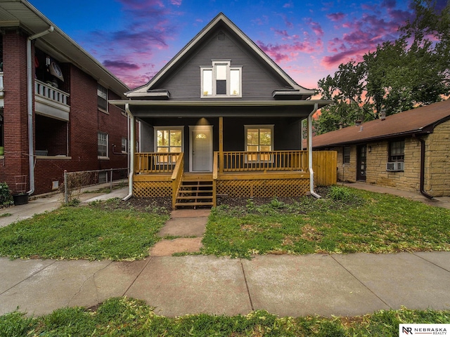 1010 E St, Lincoln, NE 68508 - bungalow-style home featuring a porch and cooling unit