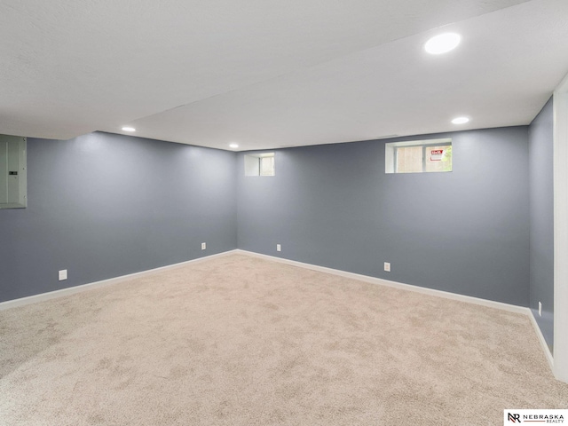 1010 E St, Lincoln, NE 68508 - below grade area with carpet flooring, recessed lighting, baseboards, and electric panel