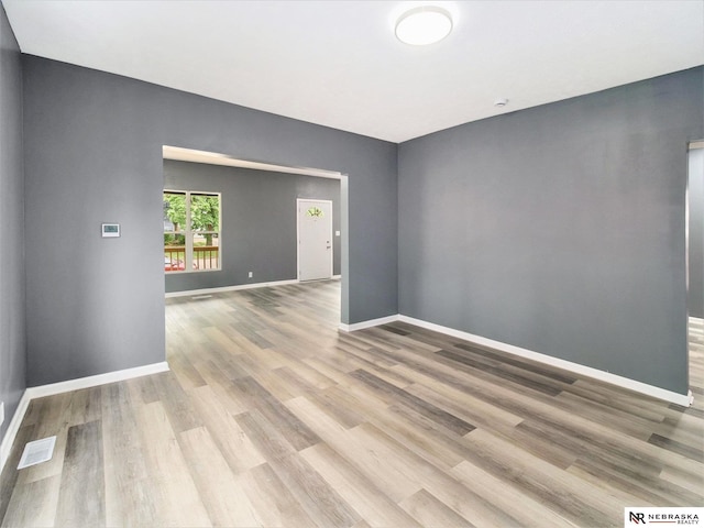 1010 E St, Lincoln, NE 68508 - empty room with wood finished floors and baseboards