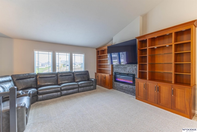 8111 S 198th St, Gretna, NE 68028 - living room featuring light colored carpet, a stone fireplace, and vaulted ceiling