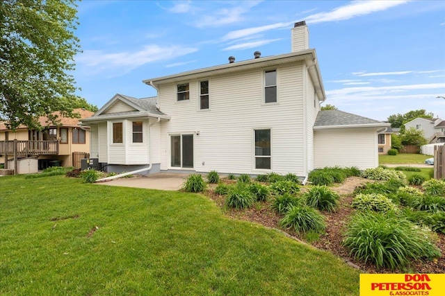 3412 Rahn Blvd, Bellevue, NE 68123 - rear view of house featuring a patio, a lawn, and a chimney
