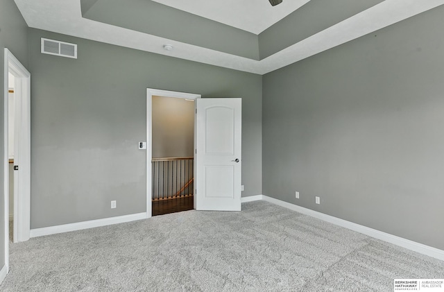 10022 S 177th St, Omaha, NE 68136 - unfurnished bedroom with carpet flooring, baseboards, and a raised ceiling