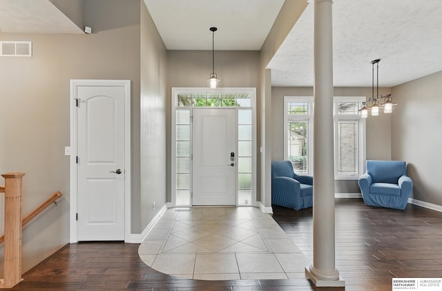 10022 S 177th St, Omaha, NE 68136 - entryway featuring baseboards, wood-type flooring, and decorative columns