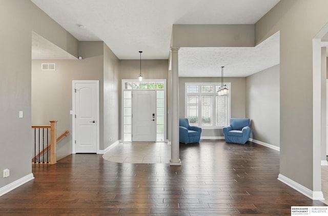 10022 S 177th St, Omaha, NE 68136 - entrance foyer featuring wood-type flooring, baseboards, and a chandelier
