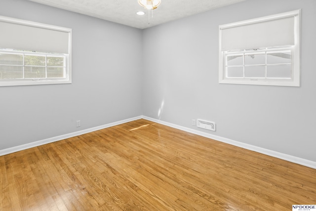 8207 Decatur St, Omaha, NE 68114 - unfurnished room with wood finished floors and baseboards