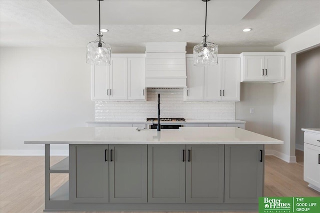 5729 N 196th St, Elkhorn, NE 68022 - kitchen with baseboards, tasteful backsplash, recessed lighting, light wood finished floors, and light countertops