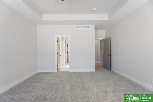 5729 N 196th St, Elkhorn, NE 68022 - unfurnished bedroom with a tray ceiling, carpet floors, and baseboards