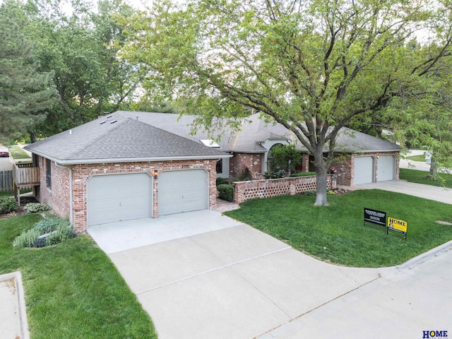 2115 Heritage Pines Ct, Lincoln, NE 68506 - single story home with brick siding, a front yard, roof with shingles, and driveway