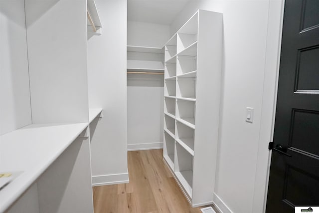 7949 Ponce Dr, Lincoln, NE 68516 - walk in closet with light wood finished floors