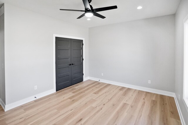 7949 Ponce Dr, Lincoln, NE 68516 - unfurnished bedroom featuring light wood-style floors, recessed lighting, baseboards, and a ceiling fan