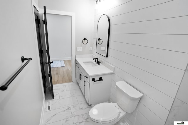 7949 Ponce Dr, Lincoln, NE 68516 - bathroom with marble finish flooring, vanity, and toilet
