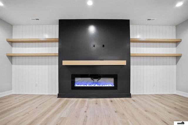 7949 Ponce Dr, Lincoln, NE 68516 - unfurnished living room with wood finished floors, baseboards, a large fireplace, and recessed lighting