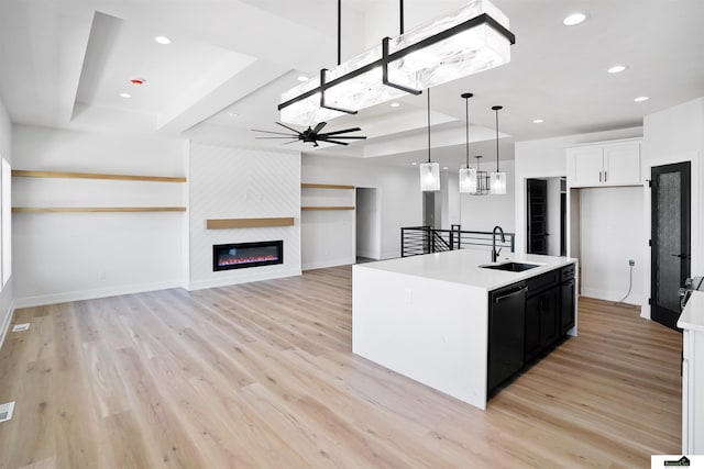 7949 Ponce Dr, Lincoln, NE 68516 - kitchen featuring a sink, black dishwasher, recessed lighting, decorative light fixtures, and light countertops